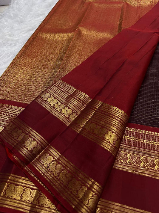 Handwoven Kanchana Brown Zari Kattam saree with spaced gold zari buttas and red contrast border.