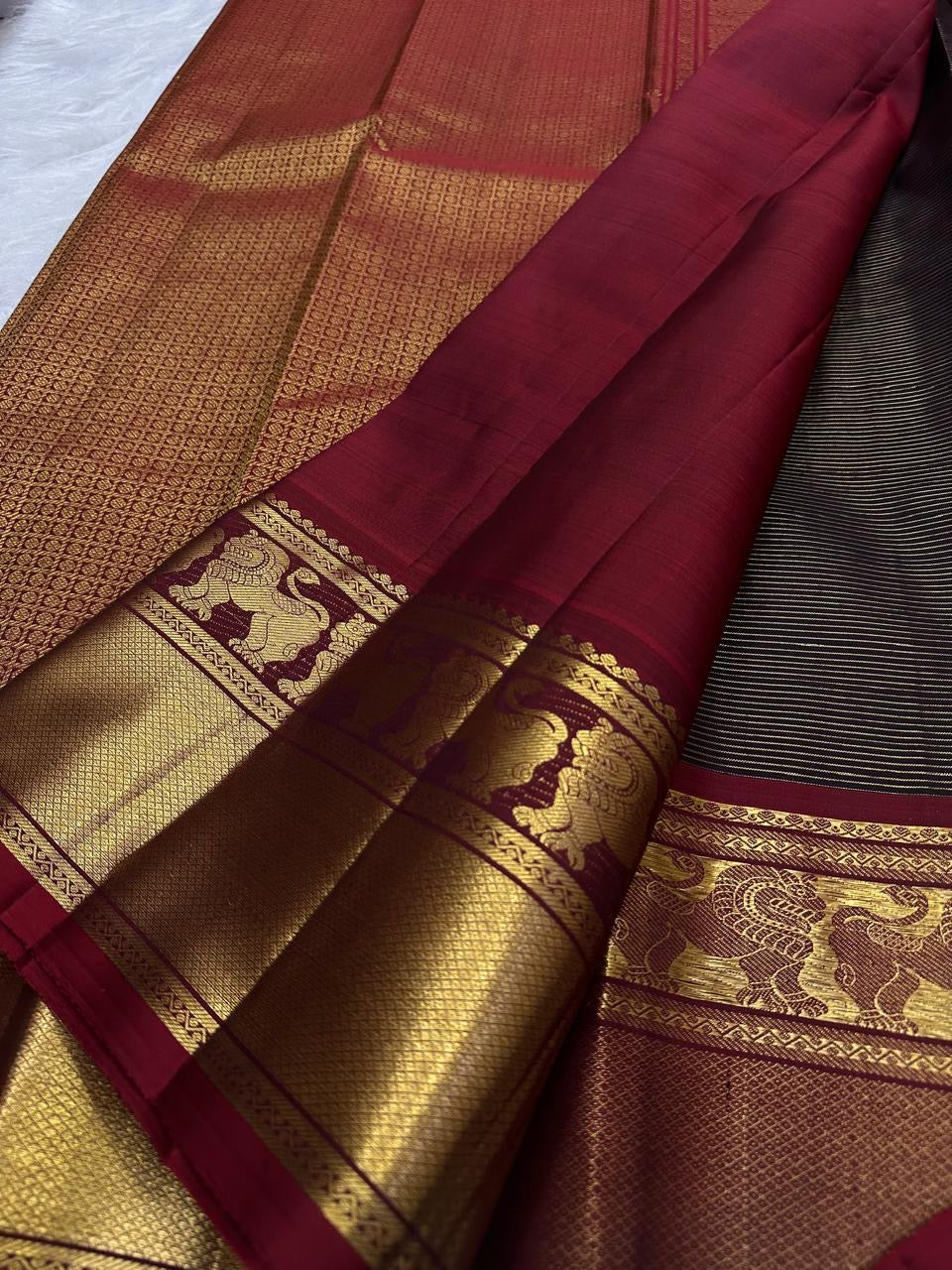 Deep brown Vairaoosi Kanjivaram saree with petite zari buttas