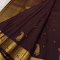 Close view of handwoven gold zari paisley buttas across Deep Kanchana Brown pure silk