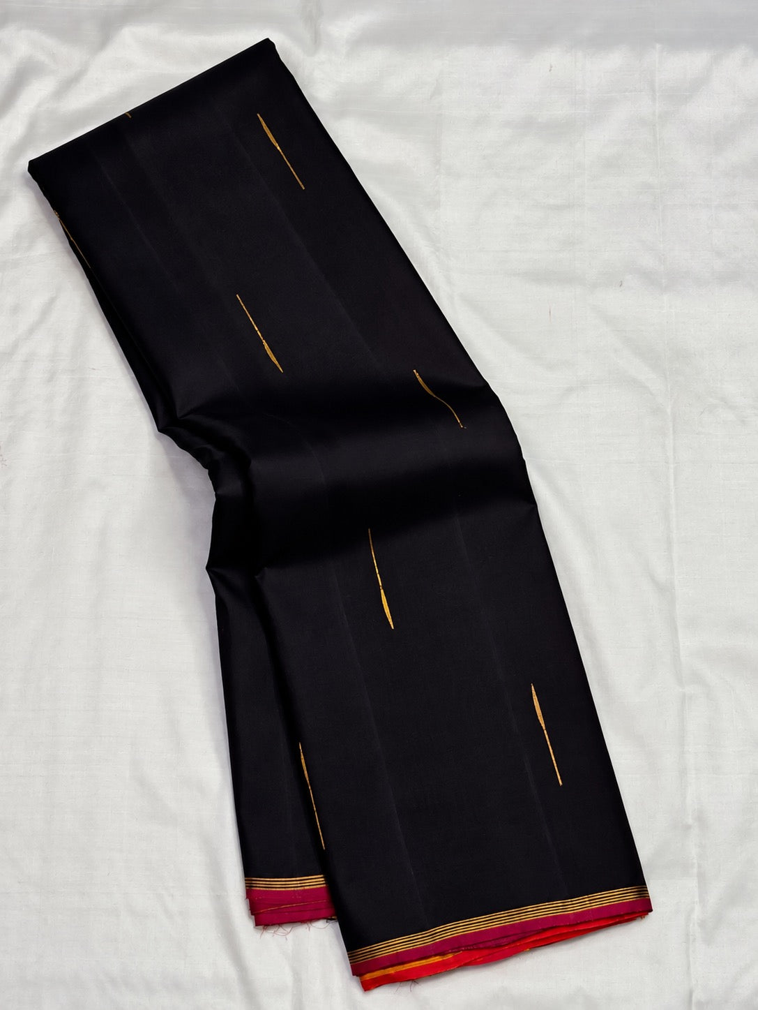 Pure silk Kanchipuram saree in Kanchana Deep Brown with Thirushnam Orange, traditional handwoven border and zari detail