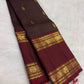 Deep brown handwoven Pure Silk Kanchi Pattu saree with fine Zari Kattam lines and an Arakku Rettapet border.
