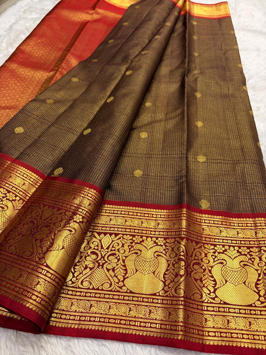 Close view of Gandaberunda motifs woven in gold zari along the Arakku red Kanchipuram border