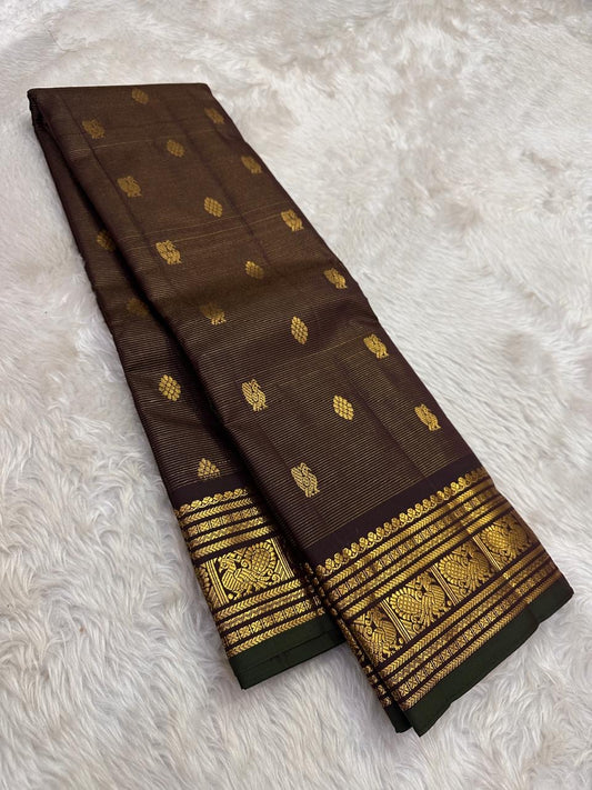Deep brown handwoven Kanjivaram saree with antique gold zari border