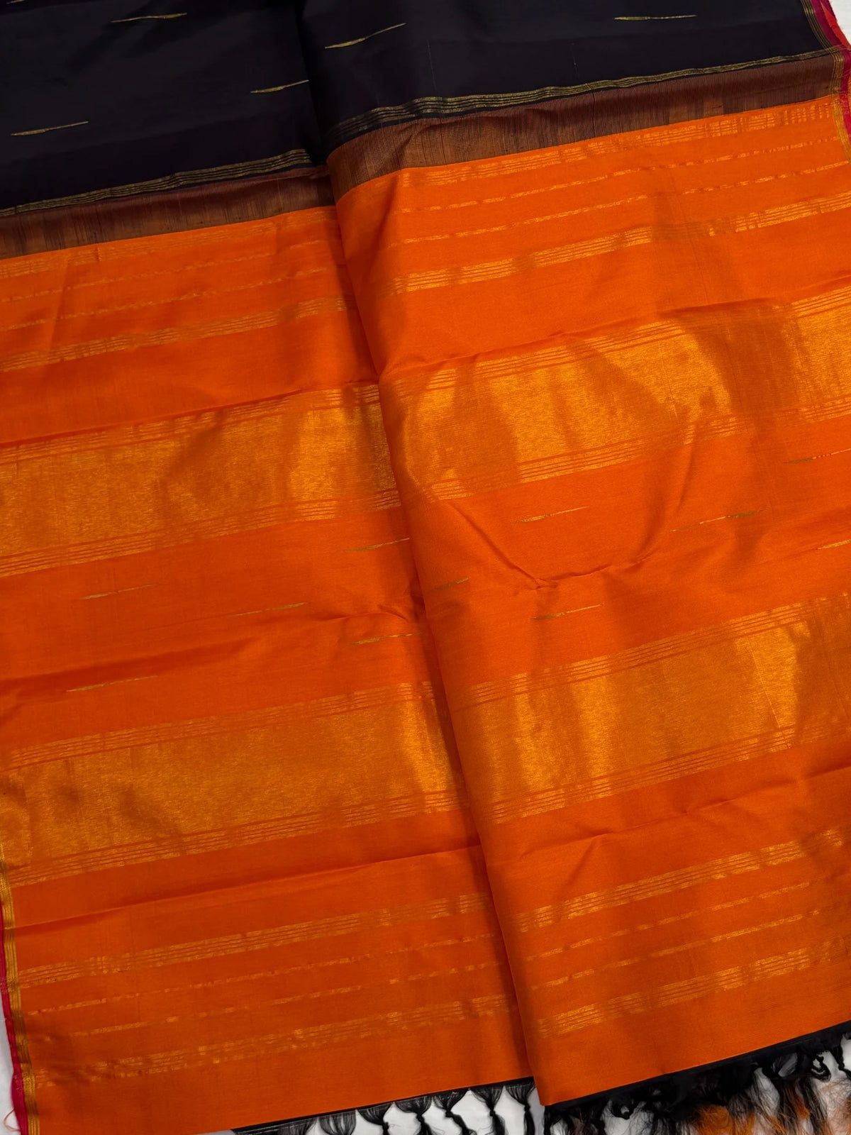 Pure silk Kanchipuram Butta saree with gold zari highlights on brown silk