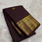 Deep brown Kancheepuram body showing spaced handwoven motifs and substantial metallic border
