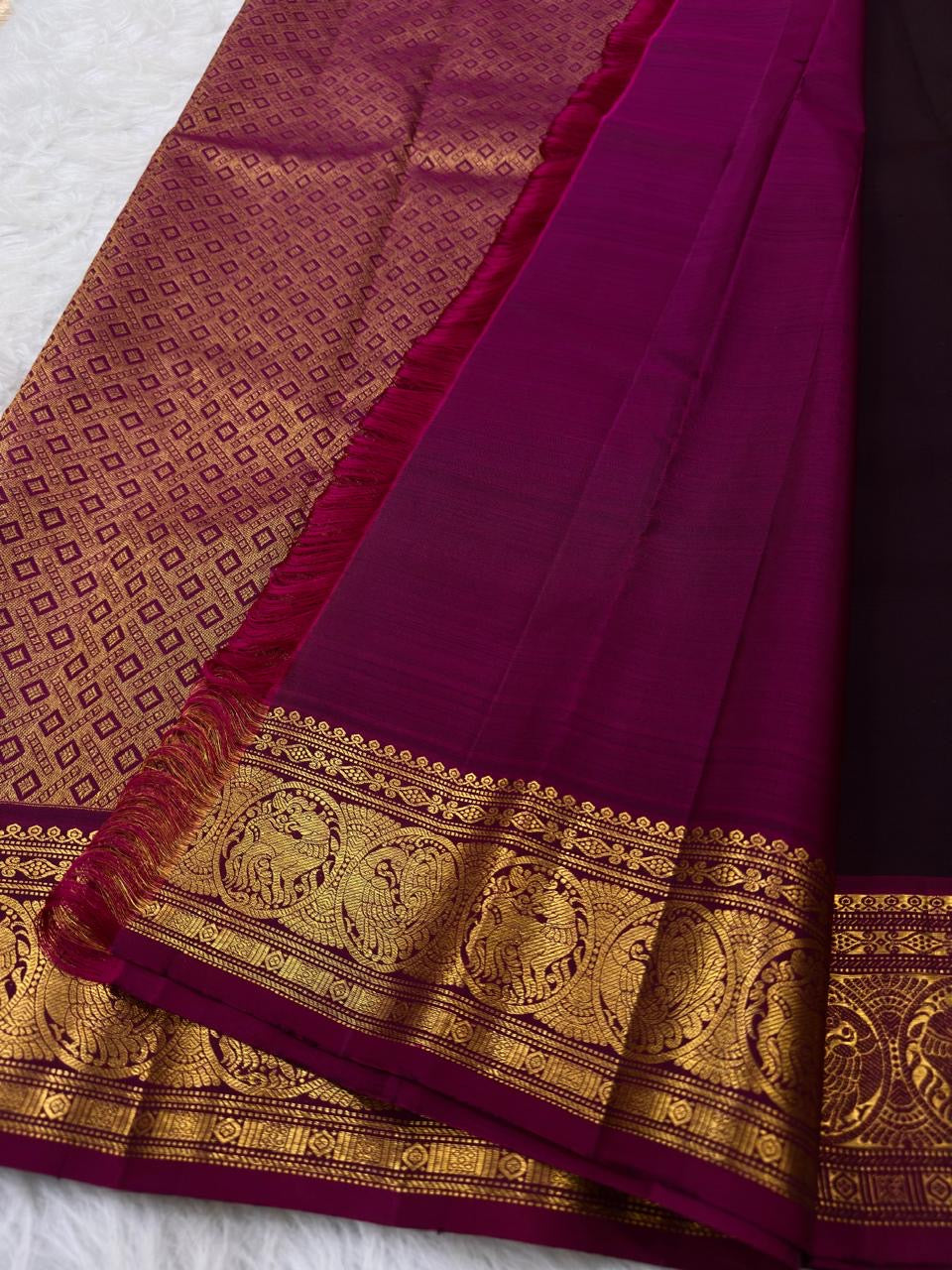 Vadamalli magenta pallu with gold zari lattice on brown Kanchipuram saree