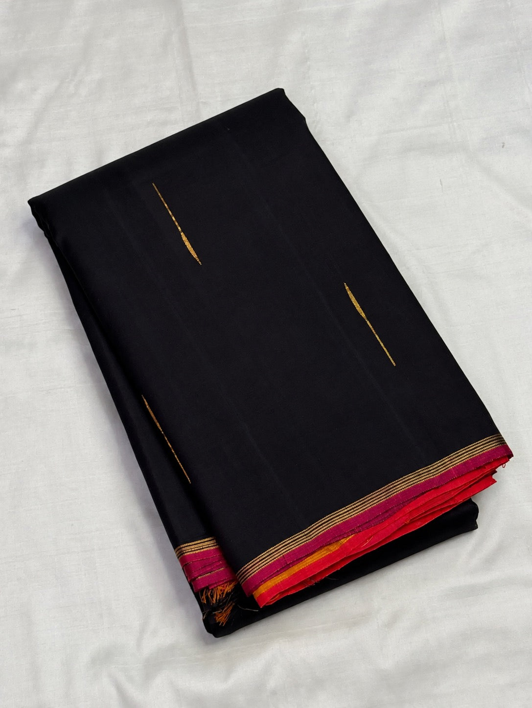 Dark Kanchana Brown Kancheepuram saree with small slender raindrop-like Malli Moggu gold buttas