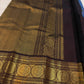 Traditional Mayil peacock border in antique gold on Deep Kanchana Brown Kanjivaram silk.