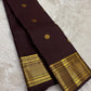Deep brown Pure Silk Kanjivaram saree with aligned Pavun zari buttas and maroon-toned border