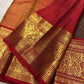 Full view of deep brown Kanchipuram silk showing fine zari grid, spaced buttas and red contrast border