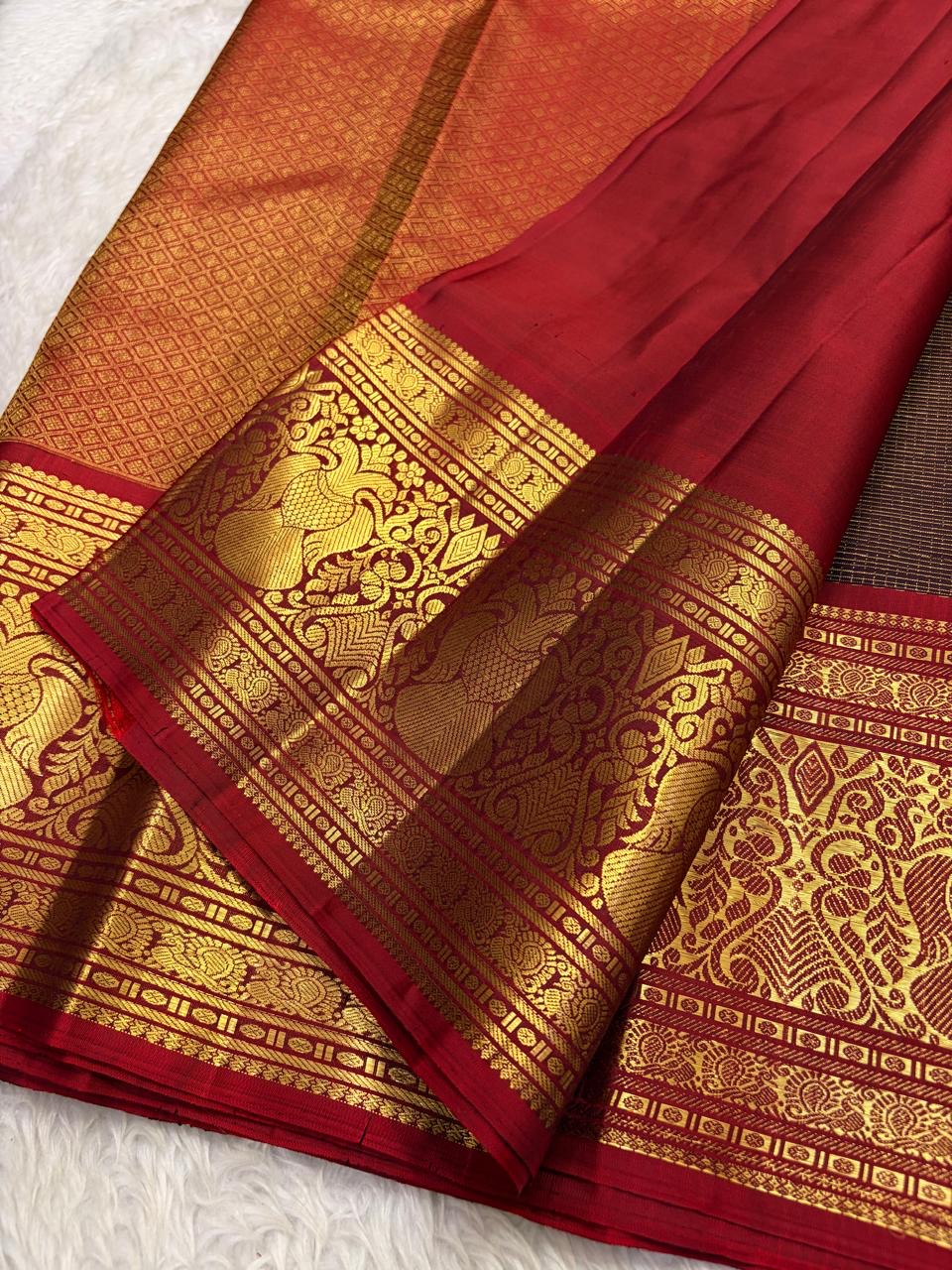 Full view of deep brown Kanchipuram silk showing fine zari grid, spaced buttas and red contrast border