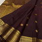 Full view of deep brown Kanjivaram Butta saree showing evenly spaced coin-inspired Pavun motifs