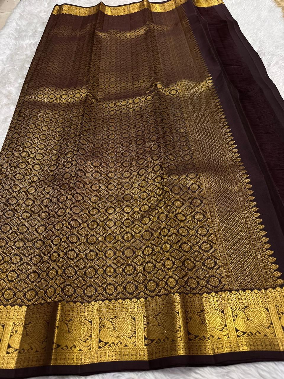 Handwoven pure silk Kanjipuram saree in deep chocolate brown with Maanga paisley butta and ornate antique gold zari border Silk Mark certified