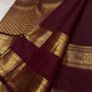 Draped Deep Burgundy silk body showing handwoven Mail buttas arranged in a precise repeating array grid