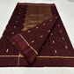 Close view of deep burgundy Chanderi fabric with petite gold zari buttas