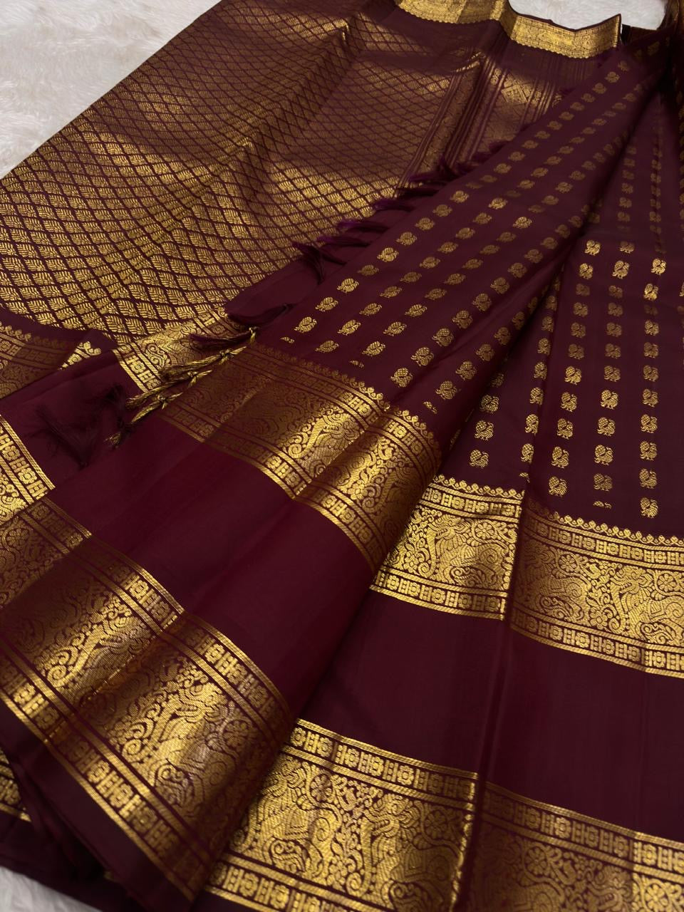 Full decorative view showing the ordered Butta body, ornate Yazhi border and elaborate pallu