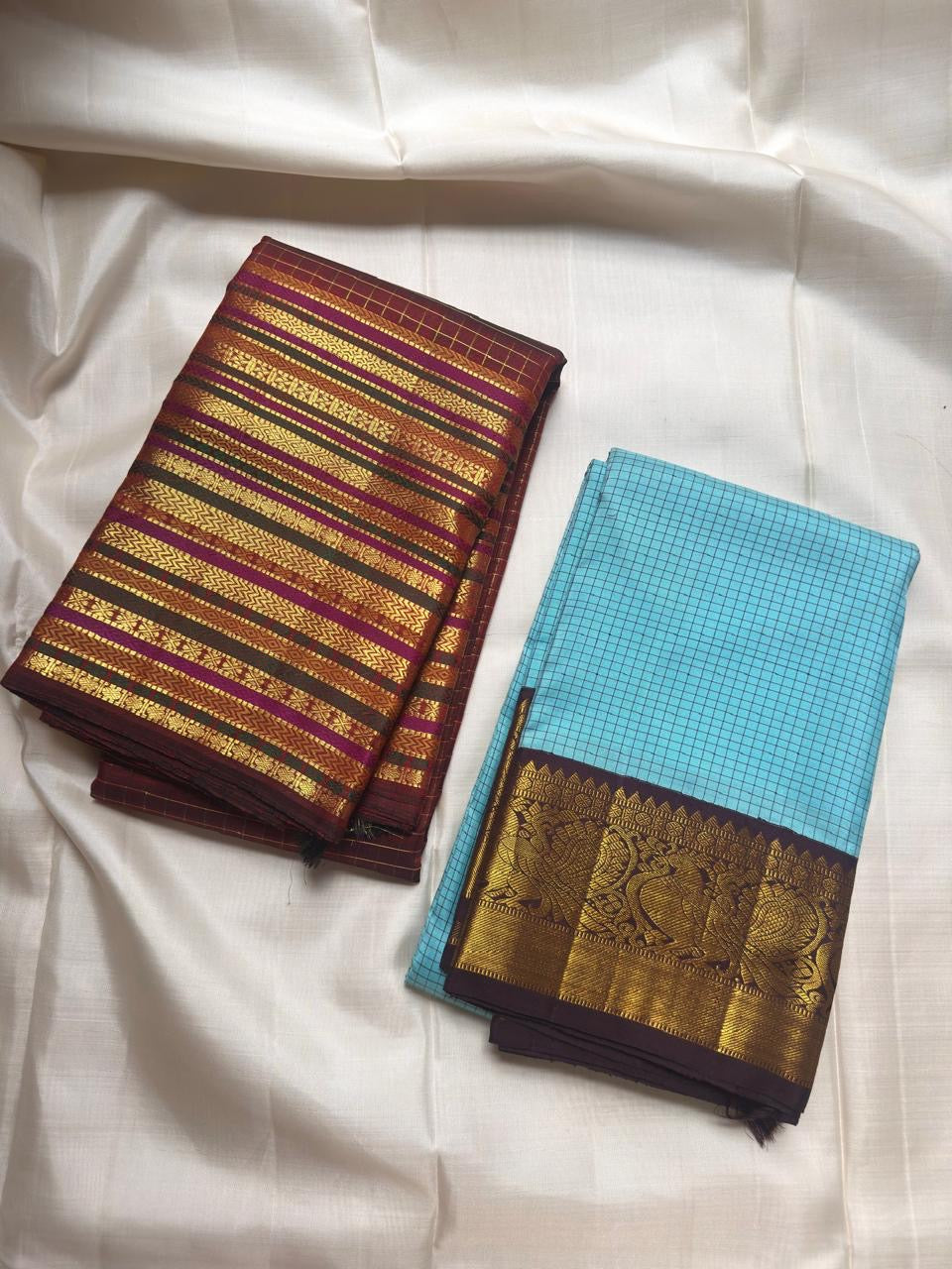 Deep cocoa maroon Kanjivaram saree with gold zari lines and Varisaipet border, close-up