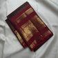 Deep Coffee Brown Kanchipuram body with fine gold Zari Kattam, petite buttas and rich red border.