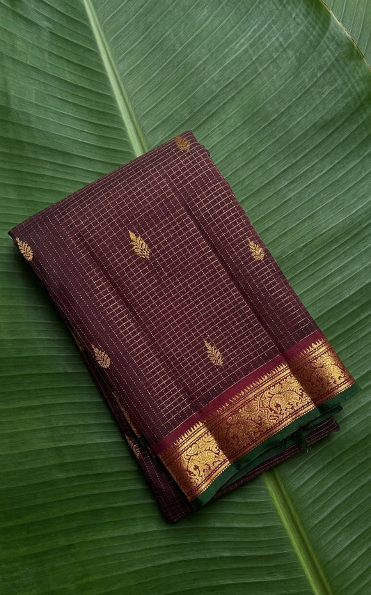 Deep coffee brown Kanchipuram silk saree with antique gold zari kattam and emerald selvedge
