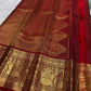Deep Coffee Brown Pure Silk Kanchipuram saree with detailed Arakku Red Gandaberunda zari border.