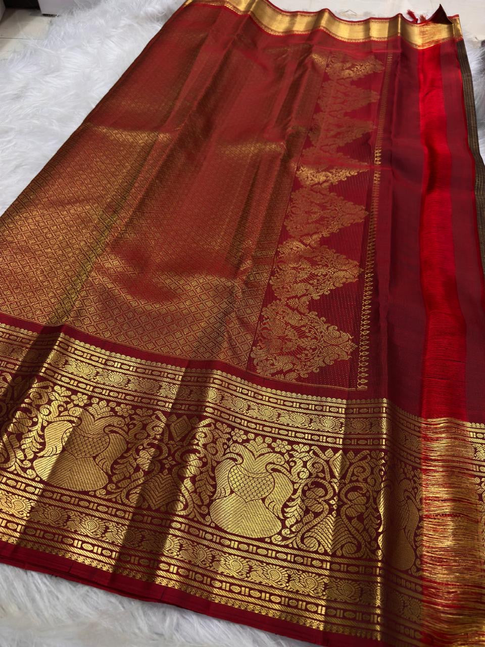 Deep Coffee Brown Pure Silk Kanchipuram saree with detailed Arakku Red Gandaberunda zari border.
