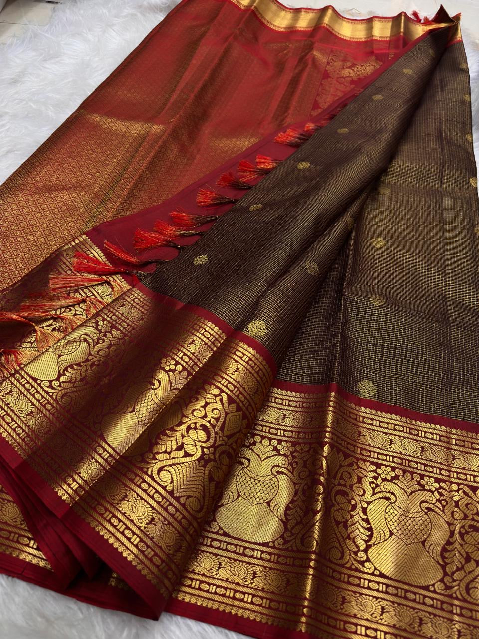 Deep Coffee Brown Zari Kattam Kanchipuram saree showing Arakku Red Gandaberunda motifs in gold zari.