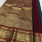 Deep Emerald Green Kancheepuram Saree — body close-up showing scattered gold zari buttas