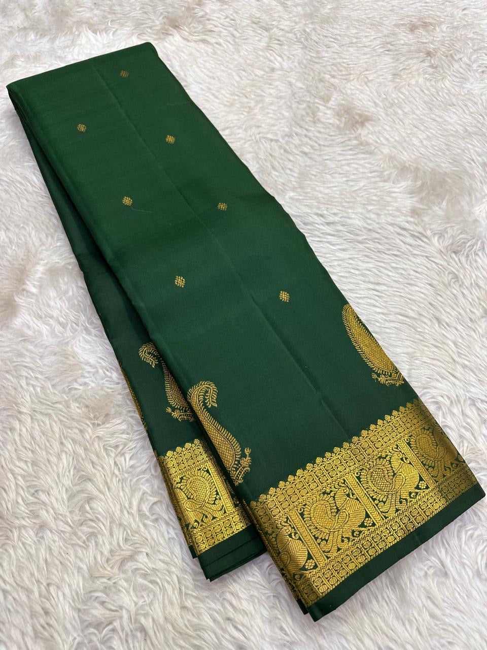 Deep Emerald Green Pure Silk Kanchipuram Butta saree with handwoven gold zari paisley motifs