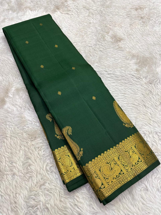 Deep Emerald Green Pure Silk Kanchipuram Butta saree with handwoven gold zari paisley motifs