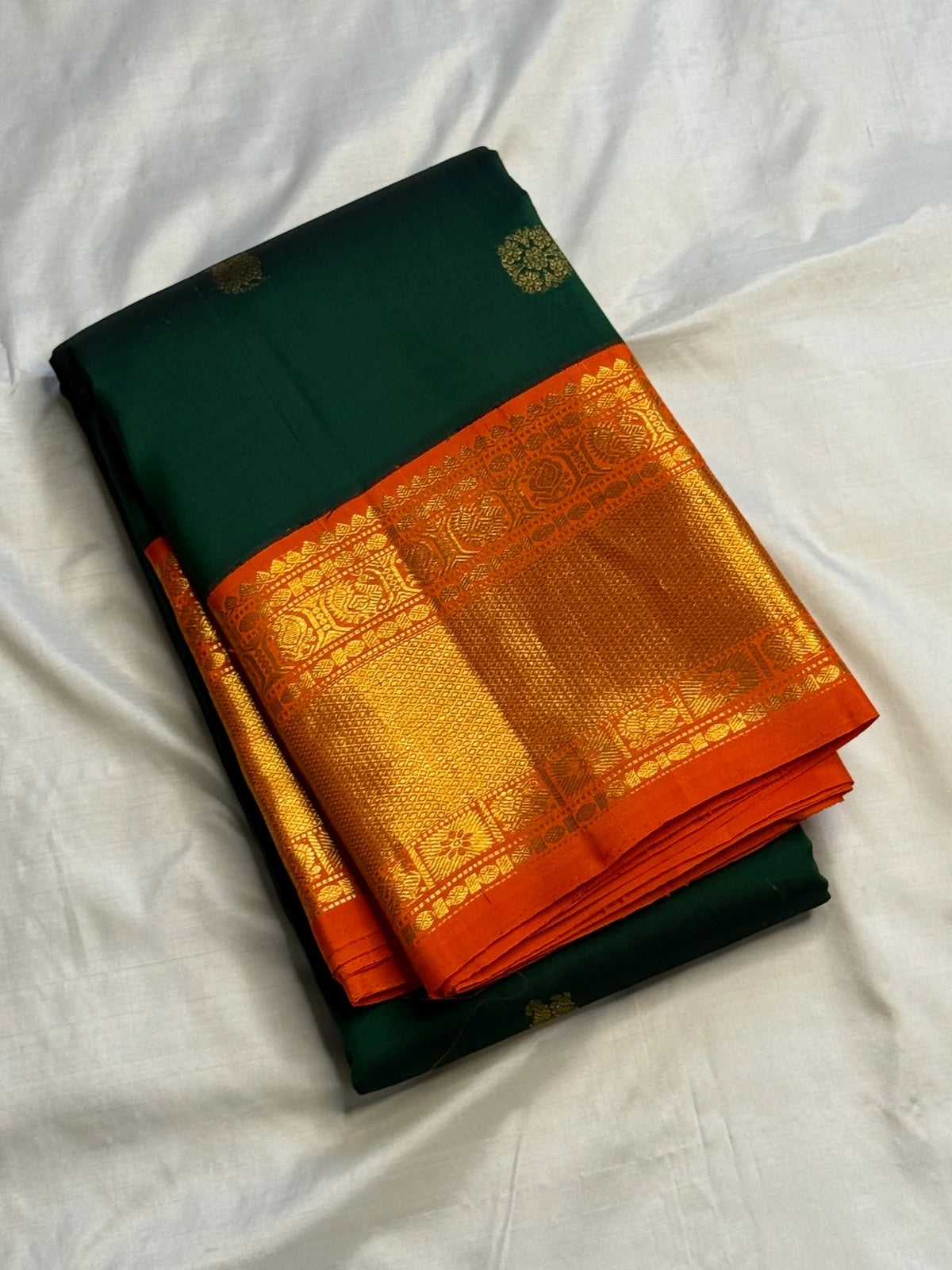 Deep Emerald Green and Radiant Orange Pure Silk Kanchipuram Korvai saree