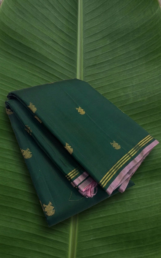 Kanchipuram silk saree in korvai with deep emerald green border weave folded view