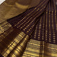 Close draped body view showing petite gold Mail buttas arranged in an orderly grid