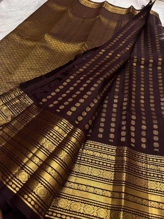 Close draped body view showing petite gold Mail buttas arranged in an orderly grid