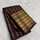 Folded body view showing handwoven Mail buttas aligned in repeated rows across dark brown silk