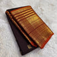 Rust orange Varisaipet border with red silk thread woven motifs on espresso brown Kanjeevaram saree