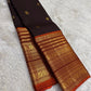 Close view of Varisaipet body showing Mayil Butta in gold zari on deep espresso brown silk