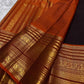 Rust orange Varisaipet pallu with red silk thread motifs on deep espresso brown saree