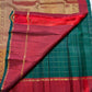 Upper border view showing the contrast between Deep Forest Green checks and Arakku Red silk