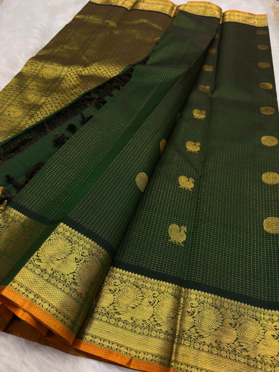 Canary gold border detail on Deep Forest Green Kancheepuram silk saree, handwoven in Kunnam village