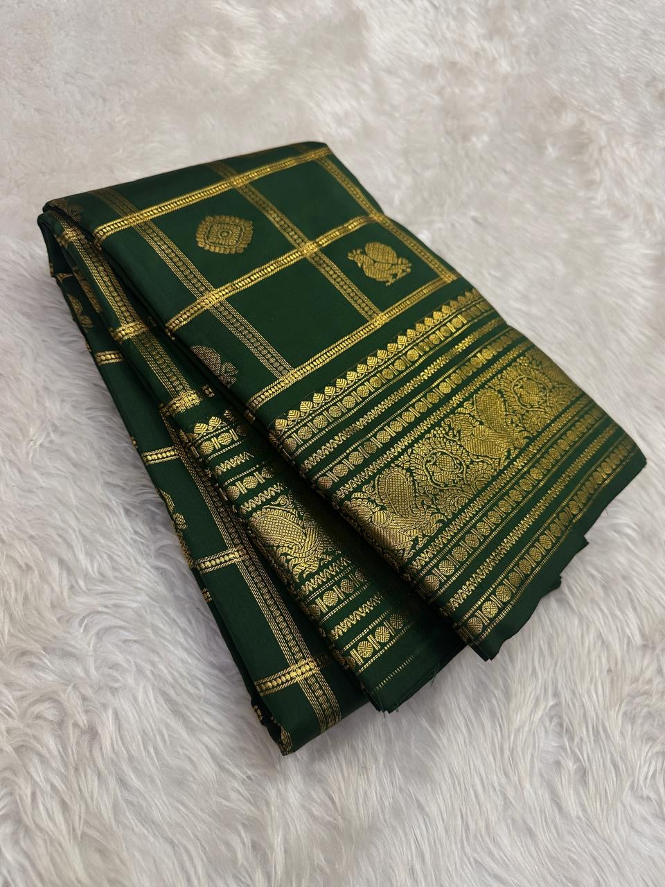 Deep Forest Green lightweight Pure Silk Kanchipuram saree with gold Zari Kattam and peacock border