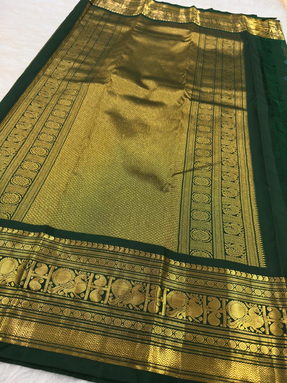 Forest green Kancheepuram saree with gold Zari Kattam