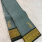 Deep Forest Green intricate Mayil gold zari border on Dusty Aqua Blue Kanchipuram saree