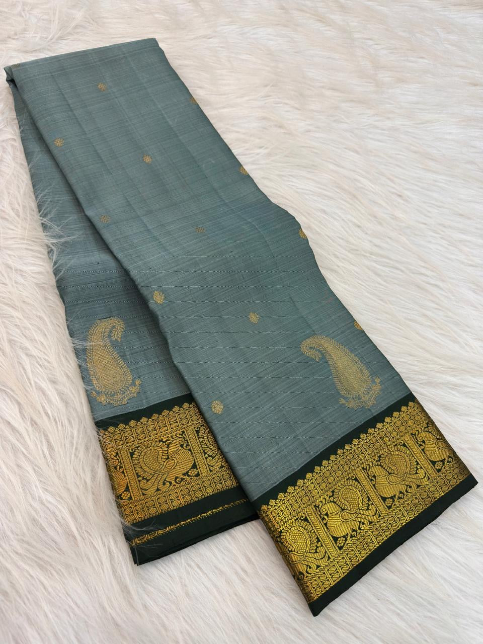 Deep Forest Green intricate Mayil gold zari border on Dusty Aqua Blue Kanchipuram saree