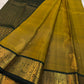Close view of Deep Forest Green Mayil zari border on Antique Mustard Gold silk.