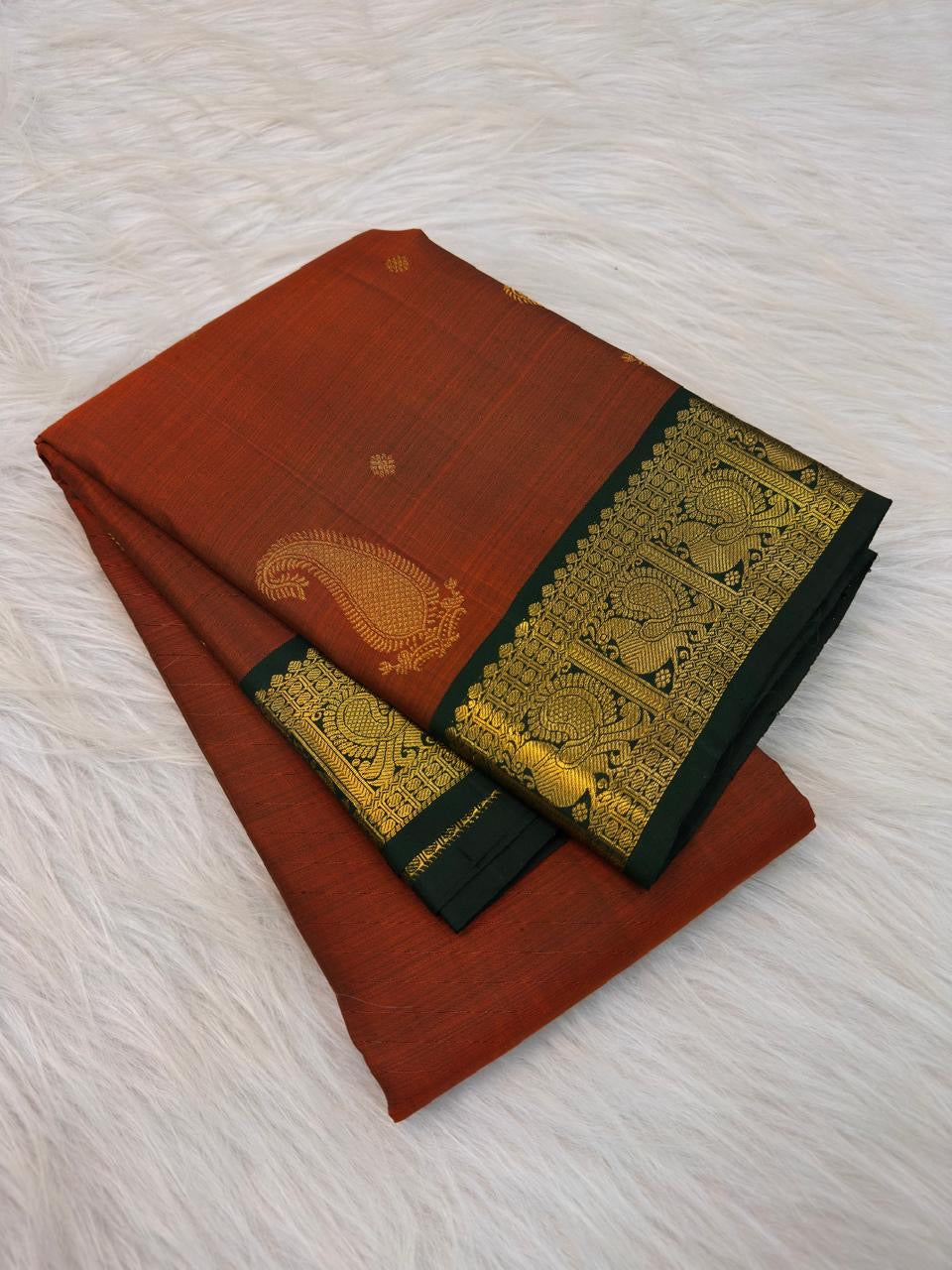 Deep Forest Green intricate zari border with repeating gold Mayil motifs on Kanchipuram silk