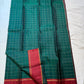 Full Deep Forest Green body showing fine dotted gold Muthu Kattam checks and red borders