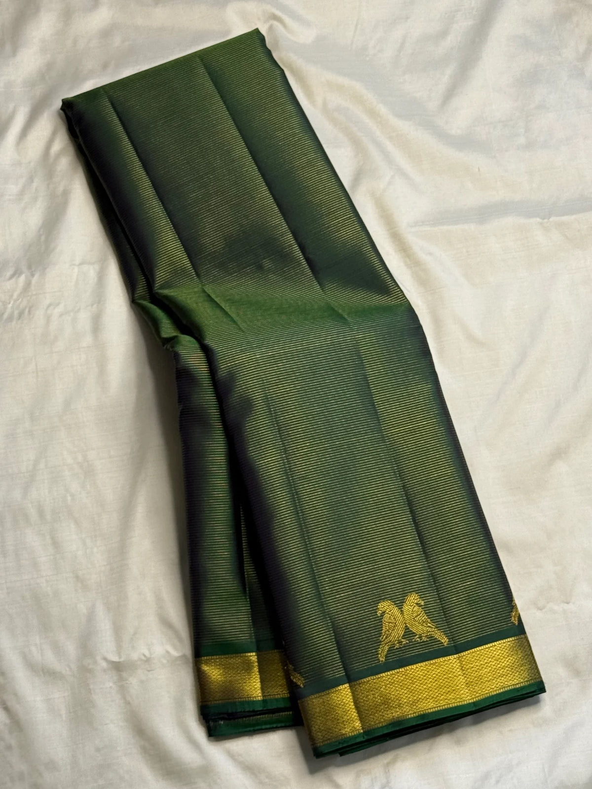 Deep Forest Green handwoven pure silk Kanjivaram Vairaoosi saree.