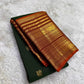 Close view of Varisaipet body showing Mayil Butta in gold zari on deep forest green silk