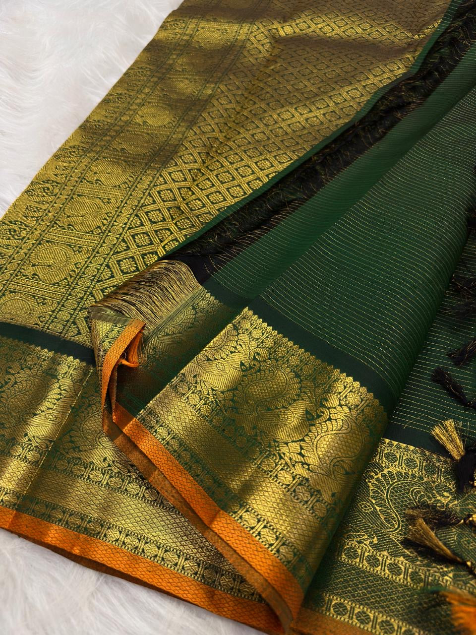 Deep Forest Green Pure Silk Kanchi Pattu Zari Kattam saree with gold medallion buttas and Antique Gold border.