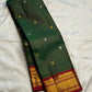 Deep Forest Green pure silk Kanjivaram Zari Kattam saree with Arakku Red pallu.